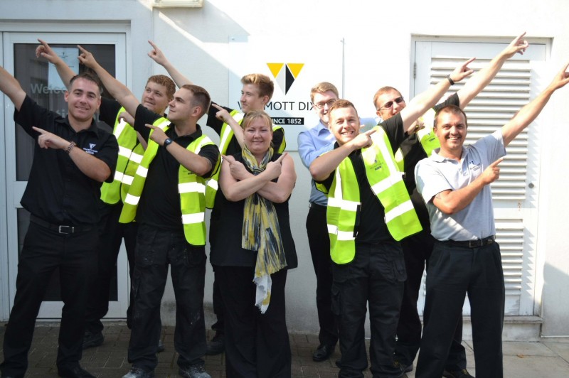 Willmott Dixon’s Jill Blight (middle) with supervisors Phil Schofield (left) and Ian Hodgson (right), operations director, Steve Gayter (back row right) with all trade apprentices