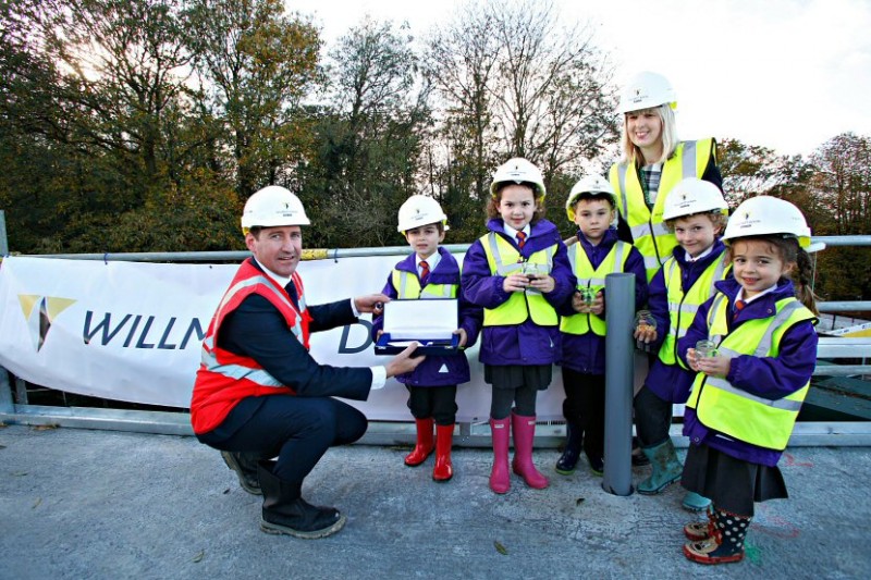 Willmott Dixon project director, Adam Worrall and Emma Bryant, Principal at Tiger Primary School, with pupils