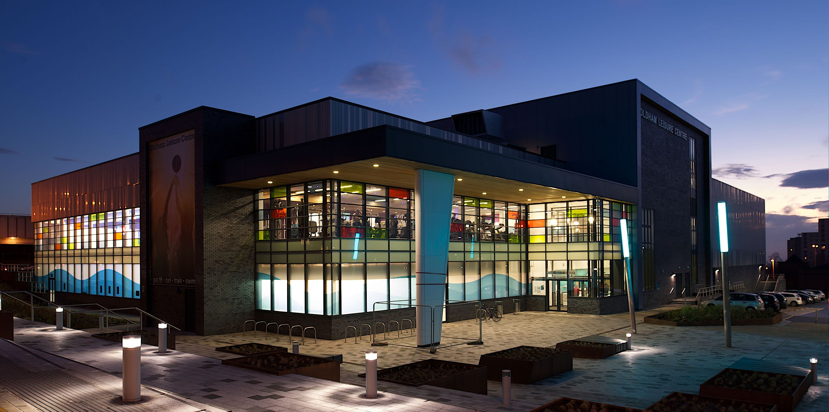 Oldham Leisure centre at dusk mid